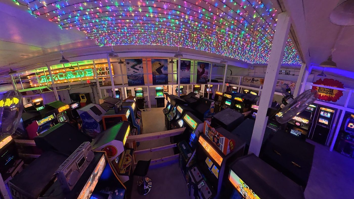 The arcade floor under a canopy of lights